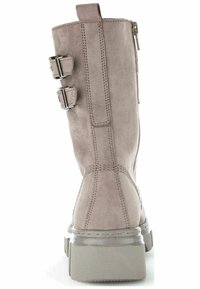 Gray suede ankle boot with two adjustable buckle straps, a side zipper, and a chunky, transparent rubber sole. Detailed stitching throughout.