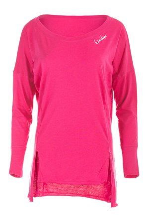 Long-sleeve pink top featuring a scoop neckline, side slits, and a soft fabric texture. Includes a white embroidered logo on the chest.