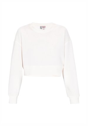 Skraćeni bijeli dukserica od mekanog pamuka. Ima okrugli izrez, duge rukave s rebrastim završetkom i čistu hemiju.