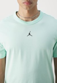 Jordan TOP - Sports T-shirts - mint foam/black