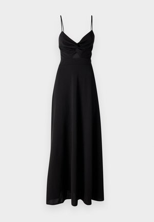 Black maxi dress with a fitted bodice, twist detail at the chest, thin spaghetti straps, and a flowing skirt. Made from soft, lightweight fabric.
