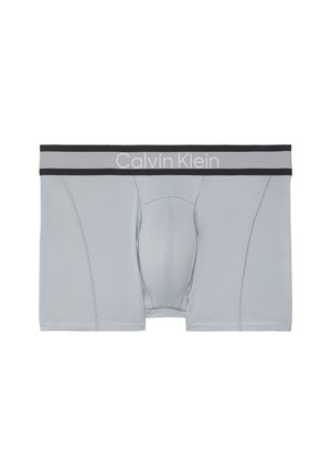 Lysegrå herreboxershorts med sort og gråt elastikbånd med "Calvin Klein"-logo i hvid.