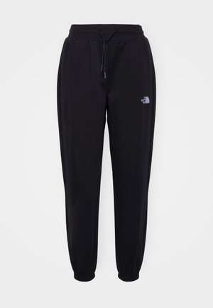 Pantaloni de jogging negri cu talie elastică și manșete, șnur de ajustare, buzunare laterale și un mic logo alb The North Face pe coapsa dreaptă.