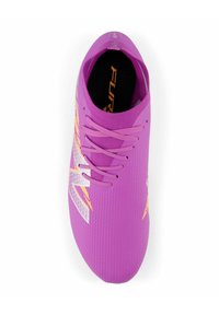 Purple athletic shoe with a textured upper, featuring gray and orange accents. Six laces and a rounded toe design. Lightweight construction.