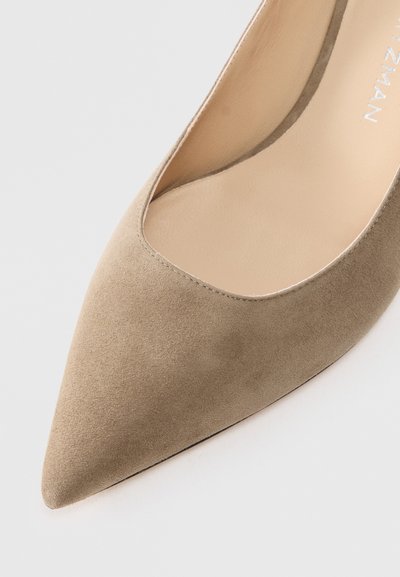 Pointed-toe pump in tan suede with a smooth texture, featuring a low cut on the sides and a beige insole. Minimalist design, no visible hardware.