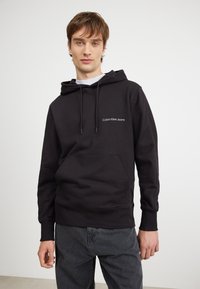 Calvin Klein Jeans INSTITUTIONAL HOODIE - Sweatshirt - black