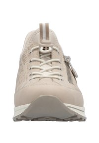 Beige athletic shoe featuring smooth synthetic material, contrasting laces, zipper detail, textured accents, and a durable rubber outsole.