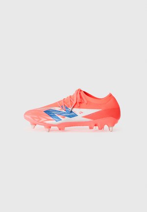 Bright pink soccer cleat with a textured surface, featuring a blue logo and white accents, designed for traction with molded studs.