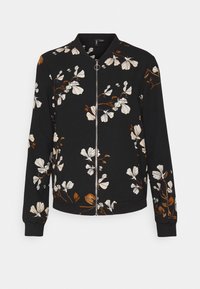Chaqueta bomber negra con un patrón floral en blanco y marrón, con cierre de cremallera y puños y dobladillo acanalados. Textura de tela suave.