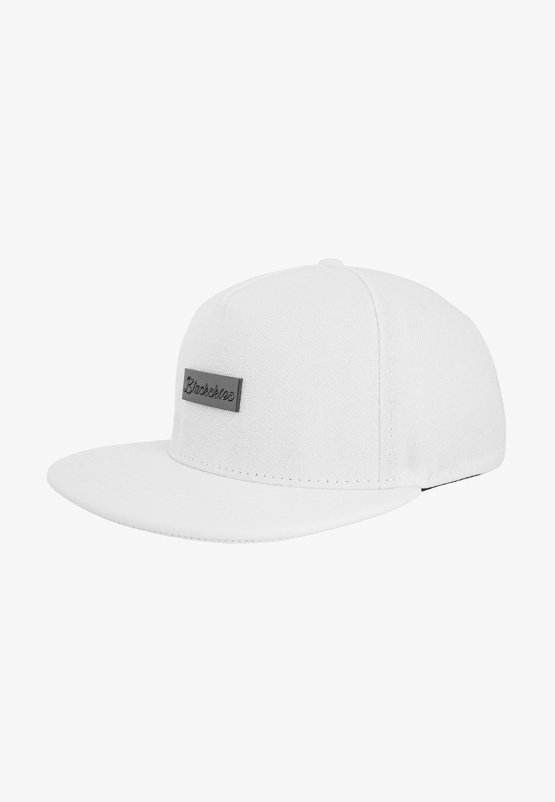 White cap with a flat visor, crafted from textured fabric. Features a stitched black logo label on the front and subtle stitching details.