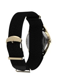 Zegarek Timex z teksturowanym czarnym paskiem z tkaniny i złotymi detalami; koperta ma okrągły kształt z przezroczystą tarczą i widocznym mechanizmem.