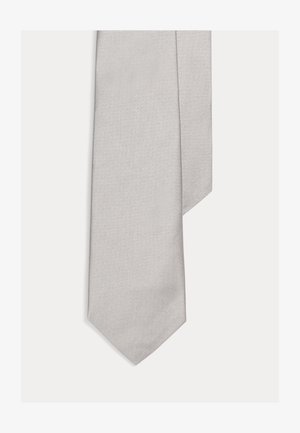 Cravată din mătase gri, cu un model subtil în zebră, capăt conic și textură netedă, având un design clasic potrivit pentru ocazii formale.