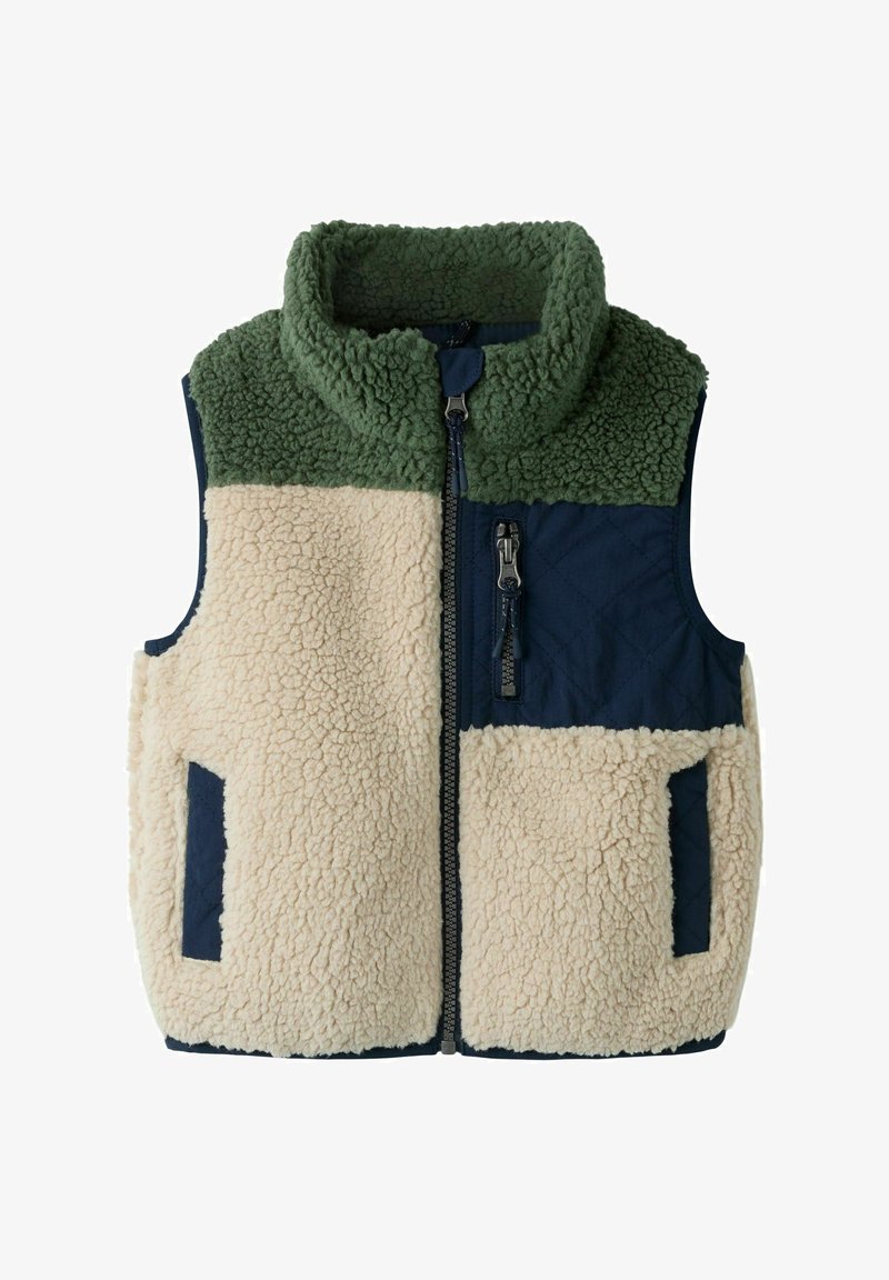 Αμάνικο φλις γιλέκο με πράσινο γιακά, εκρού σώμα, μπλε-σκούρο καπιτονέ στήθος και τσέπες, καθώς και μπροστινό φερμουάρ.