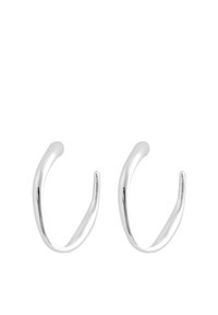 Silver hoop earrings featuring a smooth, curved design with tapered ends, reflecting light and exhibiting a polished finish.