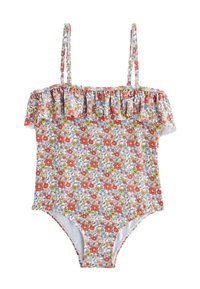 Maillot de bain une pièce floral avec encolure à volant épaules dénudées. Présente des fleurs rouges, bleues et jaunes vives sur un fond blanc.
