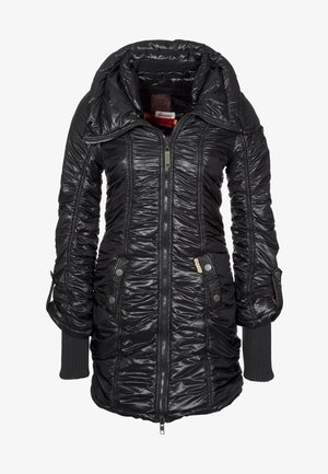 Musta, pitkä toppatakki, jossa on korkea kaulus, etuvetoketju, painonappitaskut ja hihansuista ulottuvat resorit.