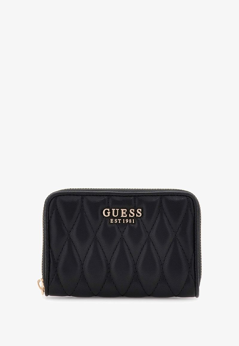 Black quilted wallet with gold logo "GUESS EST 1981," featuring a zip closure and textured surface, rectangular shape with rounded edges.