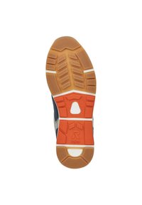 Shoe sole featuring a rubber base with a textured pattern, orange accents, and a white panel. The design includes grooves for traction.