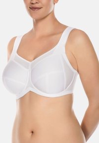 Witte bh met volledige dekking, een soepele textuur, geperforeerde accenten en brede verstelbare bandjes. Heeft een gebogen halslijn en een ondersteunende structuur.
