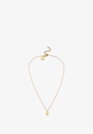 Collar de oro con una cadena delgada, que presenta un colgante circular con un diseño de estrella y un pequeño cierre ajustable en la parte posterior.