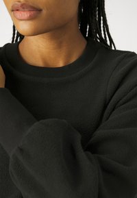 Sweaty Betty COMPASS SEAM - Pulover iz flisa - black