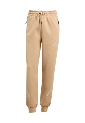 Beige sweatpants made of soft material, featuring an elastic waistband with drawstring, side zip pockets, and reflective accents.
