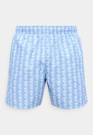 Svetlo modri kratki hlači z elastičnim pasom, na katerih je ponavljajoč se geometrijski vzorec modro obrobljenih oblik.
