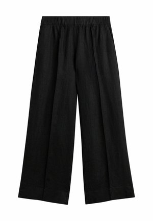 Pantalon ample noir avec taille élastique, ourlet droit, sans poches ni ornements visibles.
