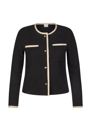 Schwarze strukturierte Jacke mit Rundhalsausschnitt, beigem Besatz, zwei Fronttaschen und silbernen Knöpfen in der Mitte. Lange Ärmel.