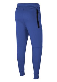 Niebieskie dresy wykonane z miękkiego materiału, z tapered leg design i czarną boczną kieszenią zapinaną na zamek, z elastycznym pasem dla regulowanego dopasowania.