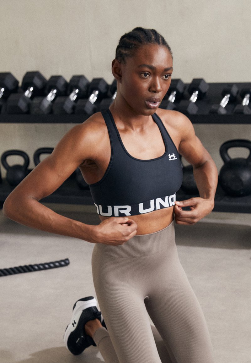 Under Armour MID BRANDED - Medium support sports bra - black/white