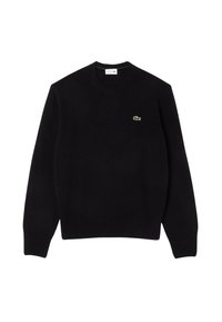 Svart stickad tröja med rund halsringning, ribbade manschetter och nederkant, med en liten grön Lacoste krokodil-logotyp på bröstet.