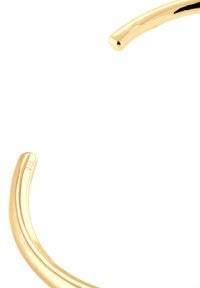 Goldfarbener Armreif mit einer glatten, polierten Oberfläche und geschwungenen Linien. Mit "925" für den Gehalt an Sterlingsilber gekennzeichnet.