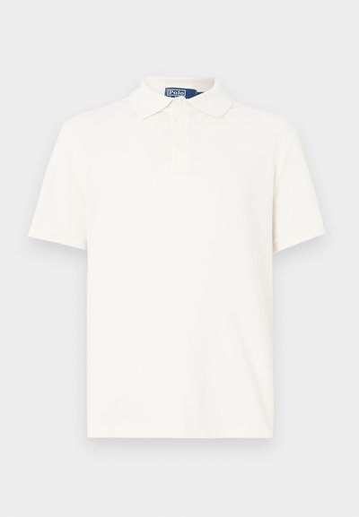 Krémové polokošeľa z textúrovaného bavlneného materiálu, s klasickým golierom, zapínaním na tri gombíky a krátkymi rukávmi. Bez viditeľných vzorov alebo zdobení.