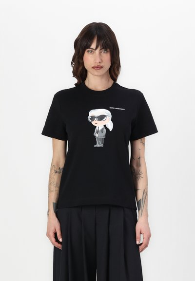 T-shirt en coton noir avec un graphique de dessin animé représentant une silhouette en lunettes de soleil et en costume, avec "KARL LAGERFELD" imprimé au-dessus de l'illustration.