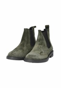 Stivaletti Chelsea in suede verde con pannelli elastici neri ai lati e linguette sul tallone. Presentano una punta rotonda e una suola bassa in gomma nera.