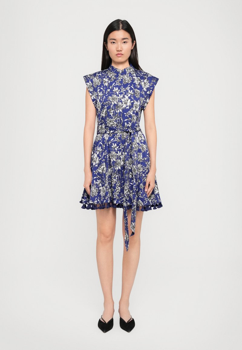Floral blue dress featuring short sleeves, a fitted waist, ruffled hem, and a tie belt, made from lightweight fabric, with a delicate pattern.