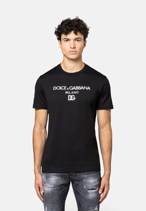 Schwarzes Baumwoll-T-Shirt mit weißem "Dolce & Gabbana Milano" Logo-Druck. Kurzärmeliger Schnitt und Rundhalsausschnitt im regulären Fit.