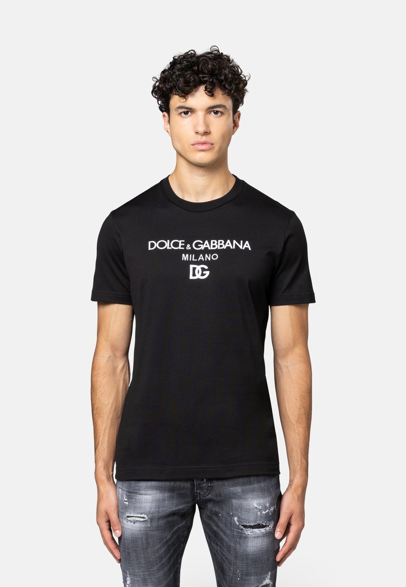 Zwarte katoenen T-shirt met witte "Dolce & Gabbana Milano" logo print. Korte mouwen en ronde halsontwerp met een reguliere pasvorm.