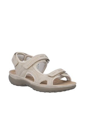 Beige sandal med åben tå med justerbare velcro-stropper, polstret indlægssål og struktureret sål til afslappet udendørs brug.