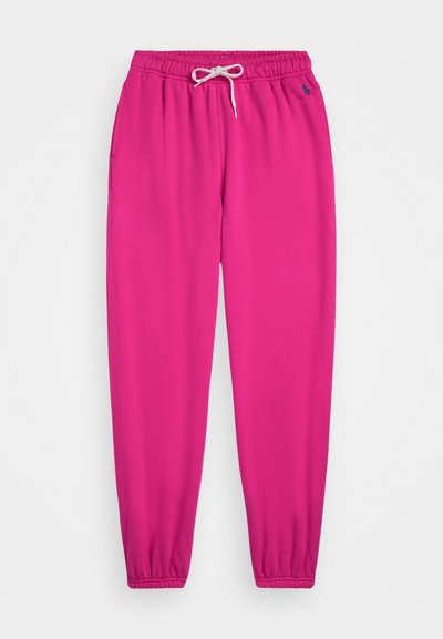 Calças jogger fúcsia com uma cintura elástica, cordão, bolsos laterais e punhos canelados. Feitas de um tecido suave e elástico.