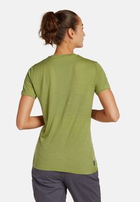 Kortärmad, olivgrön skjorta i lätt tyg med strukturerad yta, med rund halsringning och avslappnad passform.