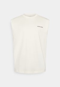 Cream-colored sleeveless t-shirt made of cotton, featuring a round neckline and a small black "BJÖRN BORG" logo on the chest.