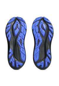 Running shoe soles featuring a black base with bright blue treads, showcasing textured patterns for grip and cushioning.