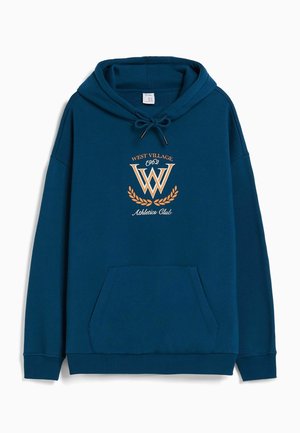 Sweat à capuche bleu foncé avec poche avant, cordon de serrage à la capuche et texte "West Village 1962 Athletics Club" avec un graphique de laurier à l'avant.