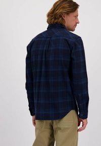 Navyblauwe geruite overhemd met een relaxte pasvorm, voorzien van een kraag, lange mouwen en een gebogen zoom, gemaakt van een katoenmix.