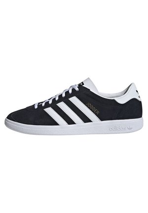 Schwarz-weißer Adidas Jogger Sneaker mit weißen Schnürsenkeln, drei weißen Streifen an der Seite und "JOGGER" Text in Gold nahe den Streifen.