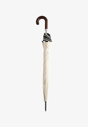 Beige umbrella with a twisted fabric pattern, black trim, and a wooden curved handle, featuring a metallic shaft and black tip.