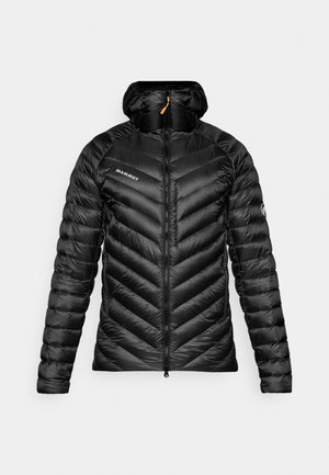 Black puffer jacket with a chevron design, zip closure, and a hood. Features a branding logo on the chest and textured, glossy fabric.