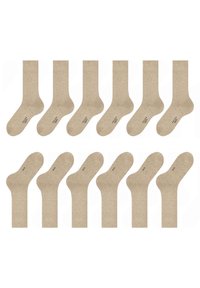 Calzini in cotone beige esposti a coppie, con una trama liscia e una lunghezza standard alla caviglia, caratterizzati da un discreto dettaglio del logo sulla soletta.